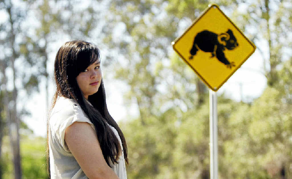 SICK ACT: Emily Furnell was brought to tears by finding a cat taped to a sign on Caboolture River Rd. SICK ACT: Emily Furnell was brought to tears by finding a cat taped to a sign on Caboolture River Rd.